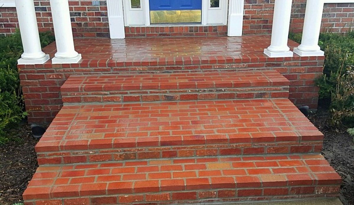 Brick steps and columns at a front entry